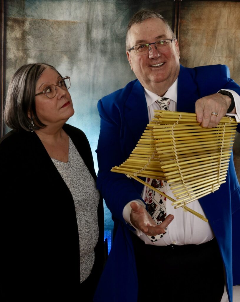 Magician and wife , She is giving him 'the look'