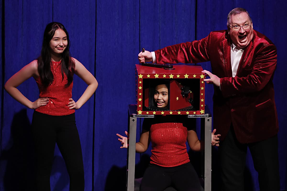 Greg Wood performing a comedy magic illusion